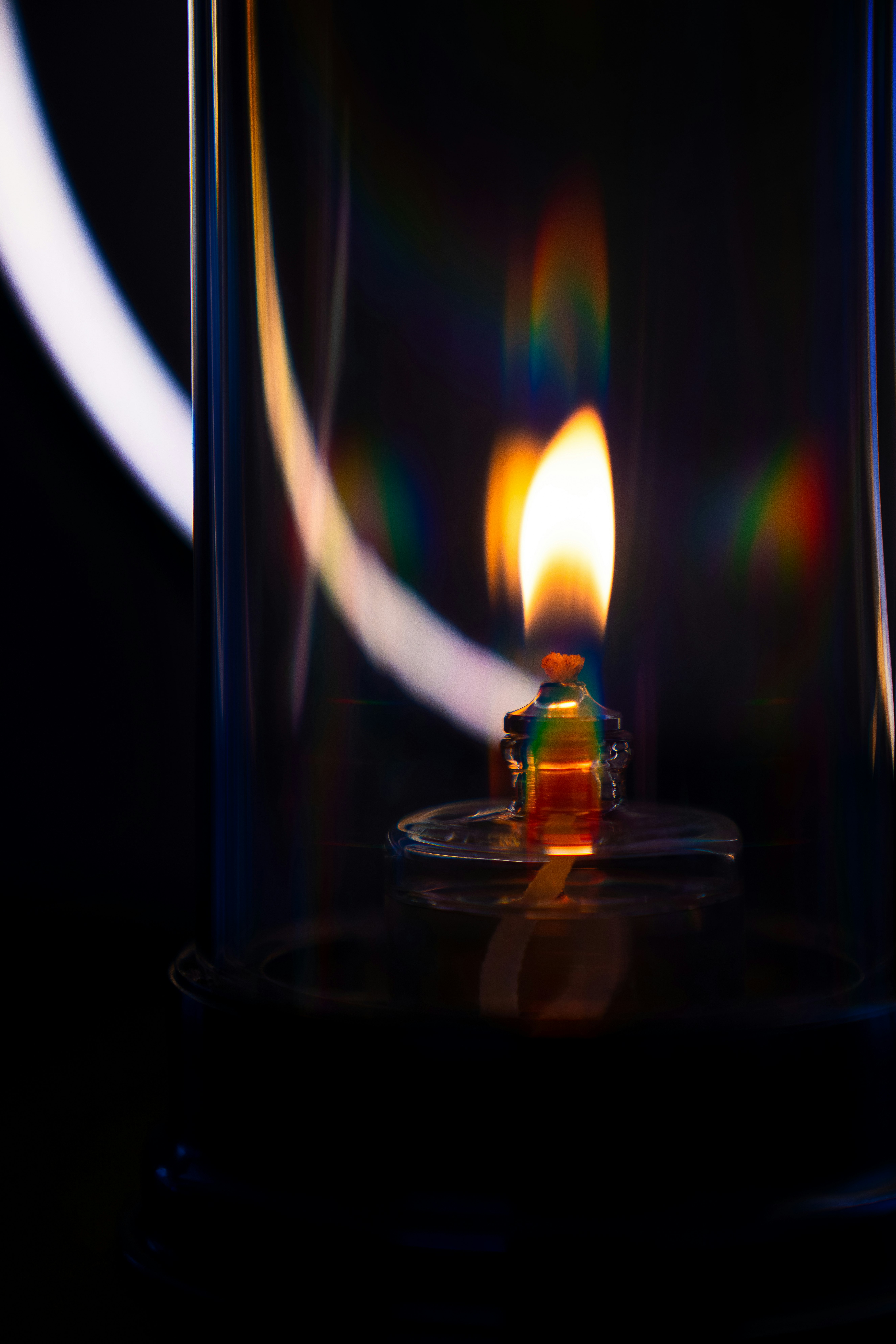 lighted candle in clear glass